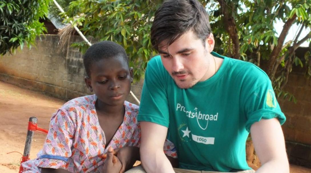 Volunteer reads with a child Volunteer reads with a child